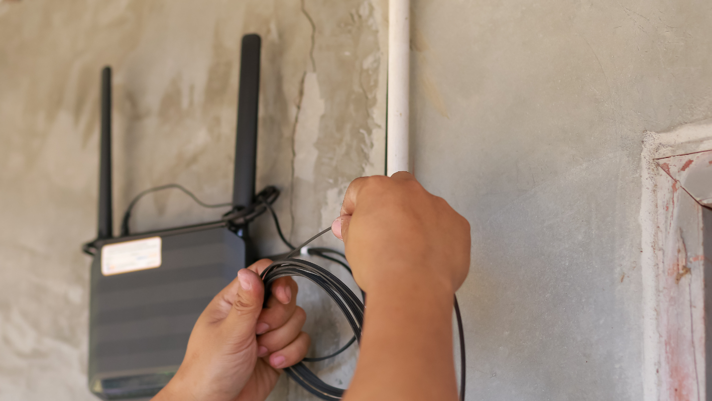 A person is plugging in to a wall outlet